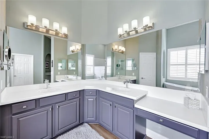 Bathroom with double vanity and plenty of natural light