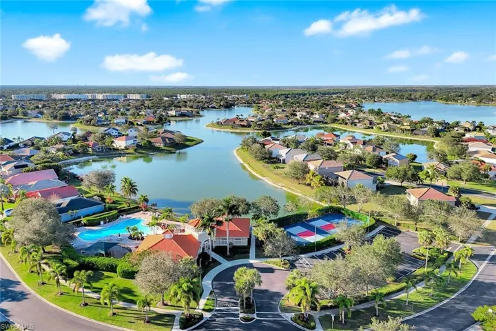 Aerial view of residential area featuring a large body of water