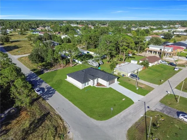 Aerial overview of property's location with nearby suburban area
