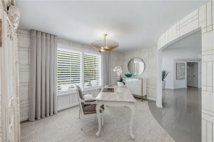 White plantation shutters with integrated window trim