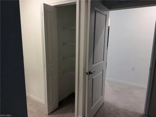 Storage closet in the primary bedroom