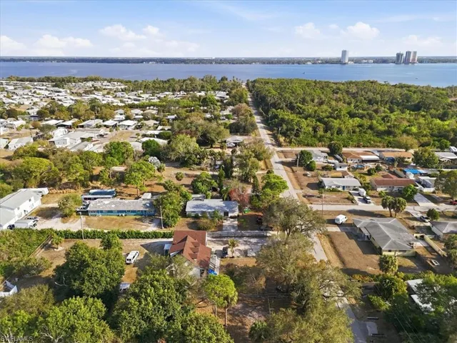 Aerial perspective of suburban area with a nearby body of water
