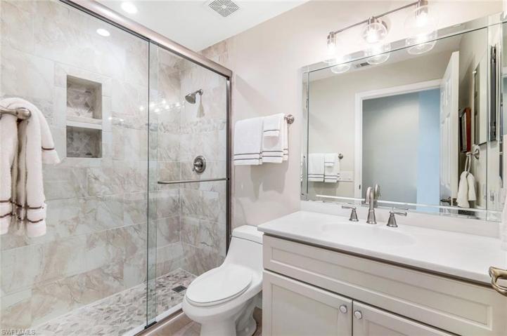 Updated guest bathroom with a walk-in shower.