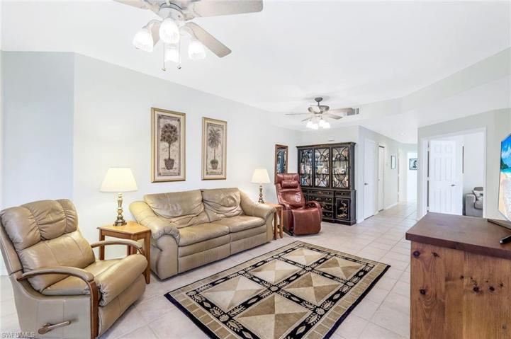 Living room is open to dining area and kitchen breakfast area.