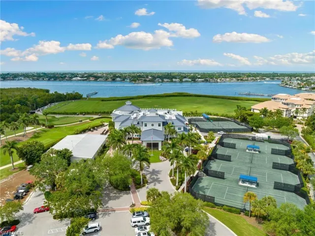 Aerial view with view of golf course and a water view