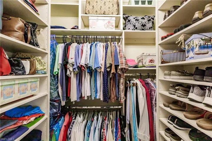 Custom walk in closet in owners bedroom