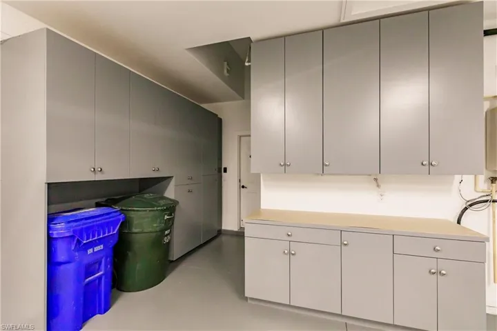 The garage is a full sized two car garage with built in storage cabinets