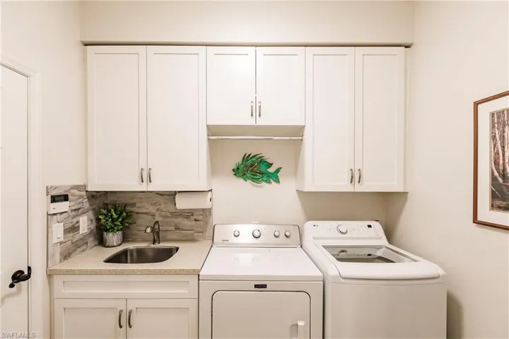 Built in storage, laundry sink and newer washer and dryer