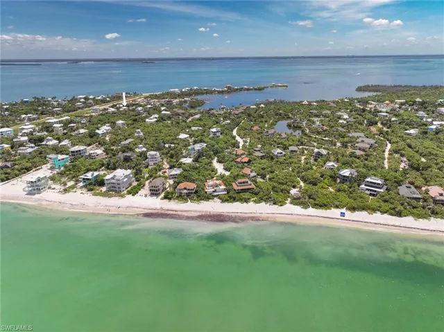 Bird's eye view with a view of the beach and a water view