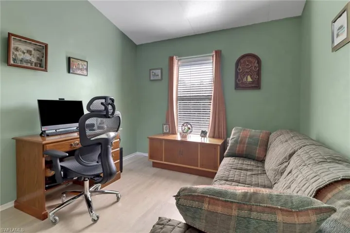 Home office with light wood-type flooring
