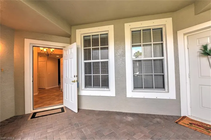 Entrance to property featuring stucco siding