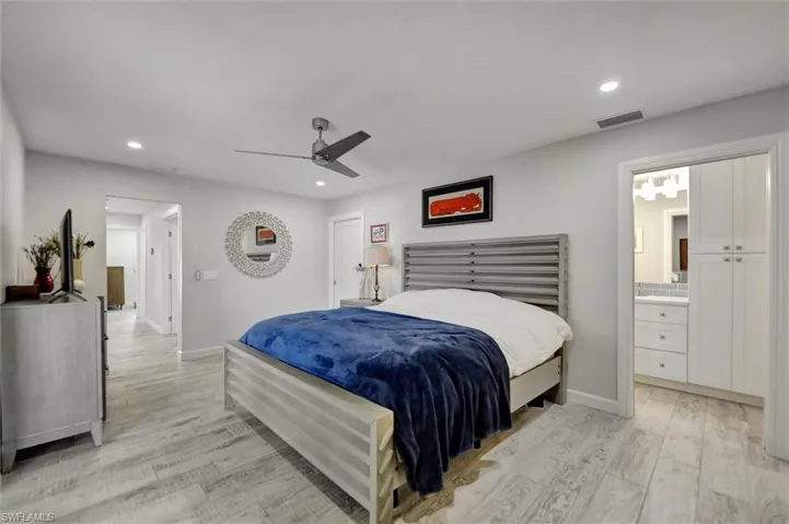 Bedroom featuring visible vents, light wood-style flooring, recessed lighting, and baseboards