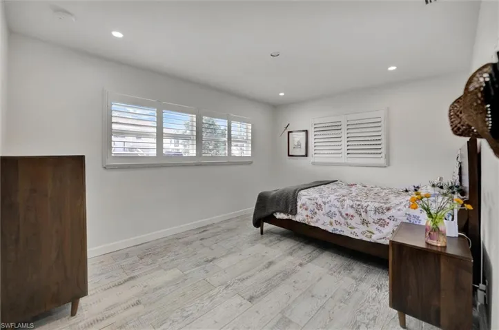 Bedroom featuring recessed lighting, baseboards, and wood finished floors