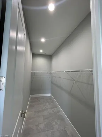 Spacious closet with tile floors