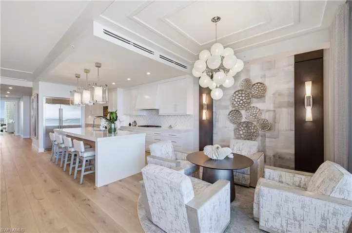 Dining area featuring a chandelier and light wood-type flooring