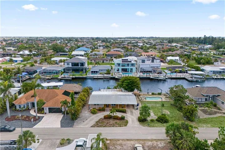 A bird’s eye view of the entire property, from the pool to the dock.