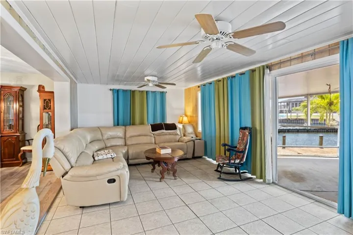 Enjoy wide-open views of the canal or backyard right from your main living area.