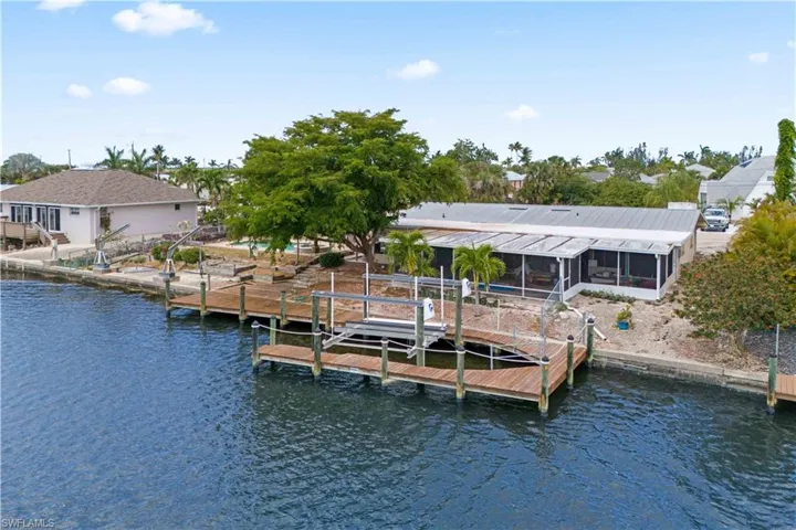 63-ft dock with 12,000 lb. boat lift and direct water access.