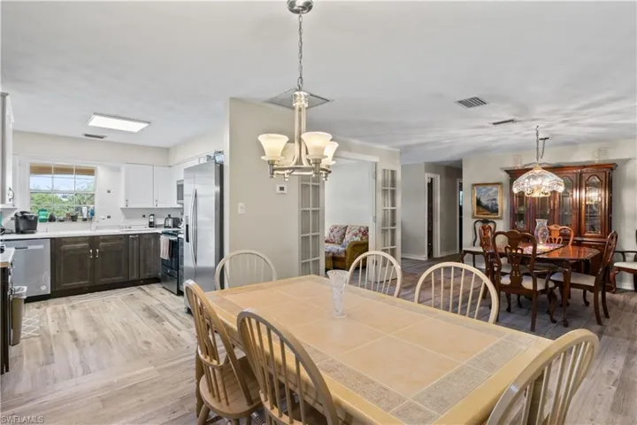 Flowing layout connecting living, dining, and kitchen.