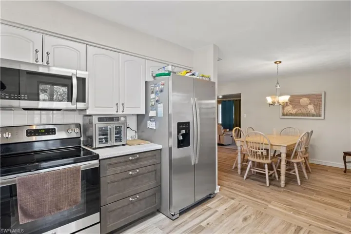 The kitchen boasts generous counter space, ample cabinetry, and new appliances—ready for you to move in and start cooking.