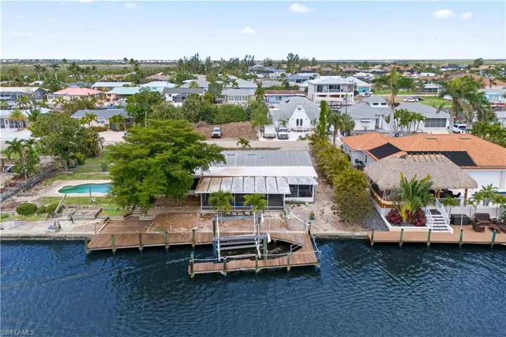 Stunning aerial view of the back of home from the canal.
