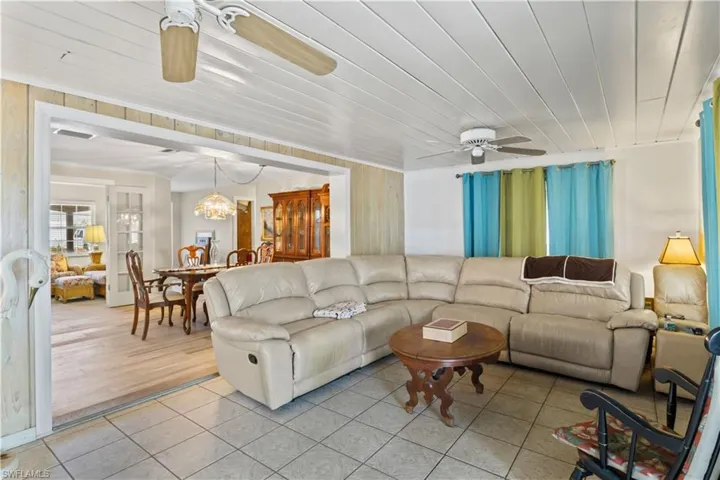 The living area flows effortlessly into the kitchen and dining spaces, creating a bright and connected central hub of the home.