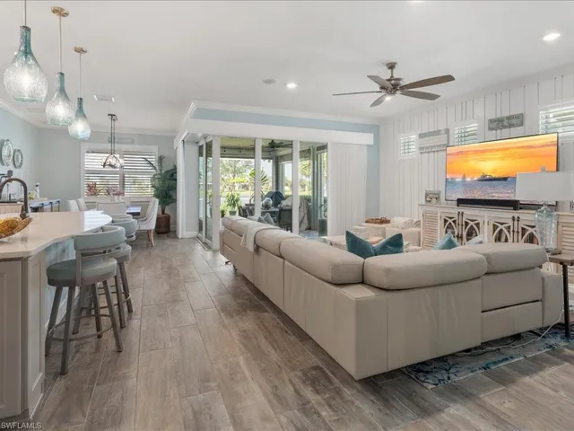 Great room opens to the outdoor living space with zero sliders and tons of natural light