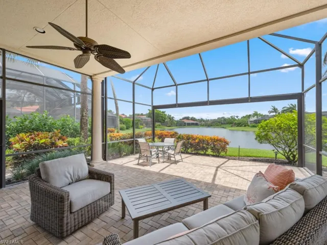Screened lanai with a water view