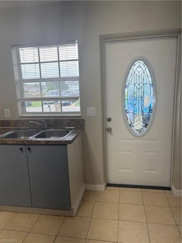 Entry door featuring decorative oval glass