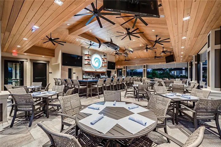Dining room with beam ceiling, high vaulted ceiling, and wooden ceiling