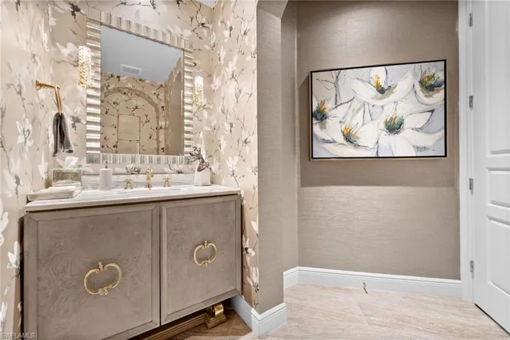 Bathroom featuring vanity and baseboards
