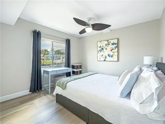 Bedroom with light wood-type flooring and ceiling fan