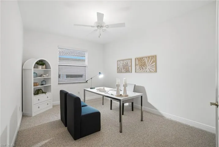 4th Bedroom is staged as a office.  Double French door privacy with wide entry point.