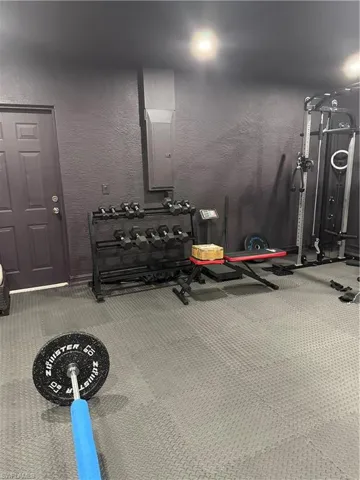 Exercise room featuring a textured wall