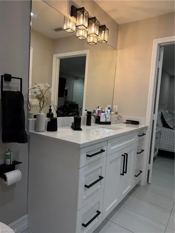 Bathroom with connected bathroom and vanity