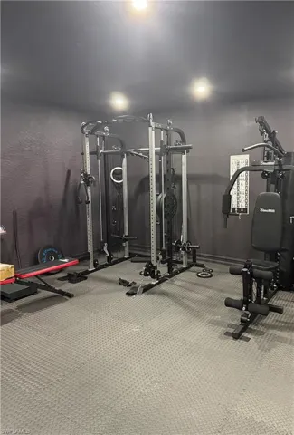 Exercise room featuring recessed lighting