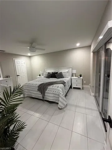 Bedroom featuring access to outside, a ceiling fan, and recessed lighting