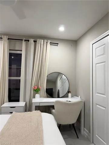 Bedroom with a desk, recessed lighting, and tile patterned flooring