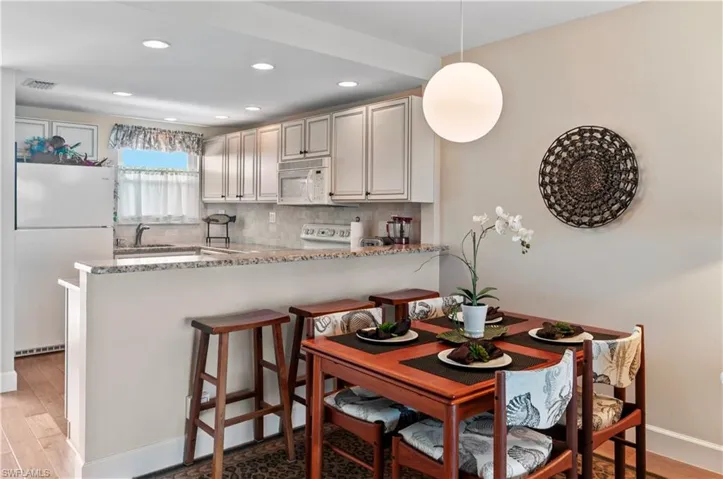 Dining room and kitchen, with granite counters