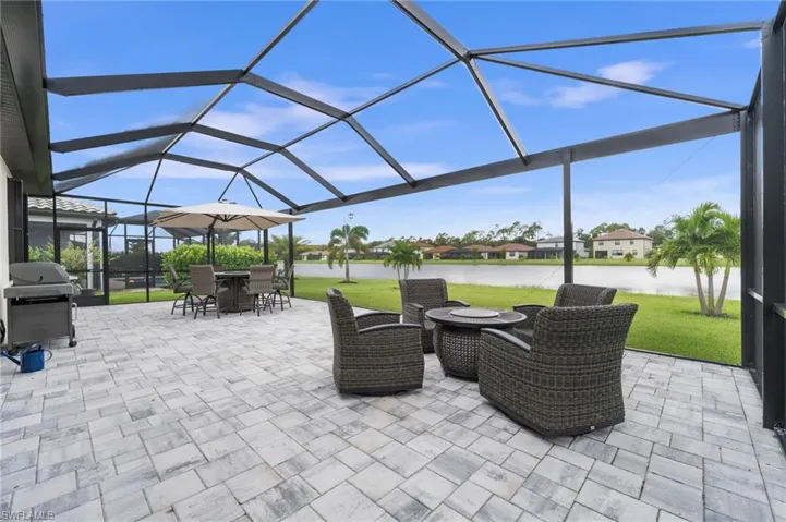 View of patio / terrace with glass enclosure and a grill