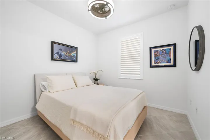 Bedroom featuring light tile patterned floors