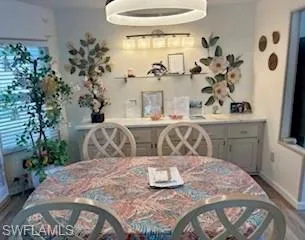 Dining space with wood-type flooring