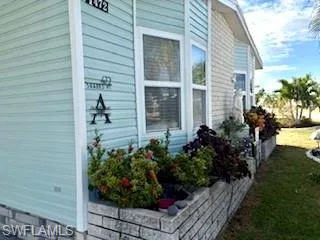 View of property exterior featuring a landscaping