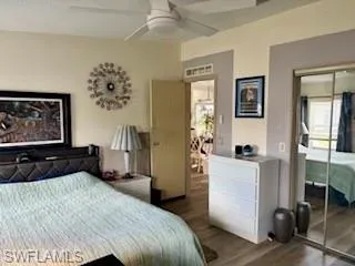2nd Bedroom with wood-type flooring, a ceiling fan, and a closet