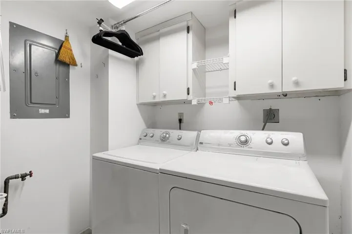 Separate laundry room iwth door.