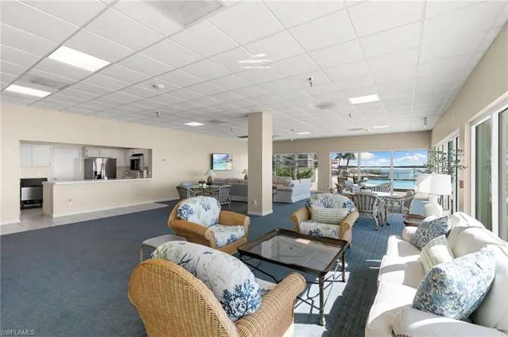 Social room with kitchen and ice maker and large screen TV