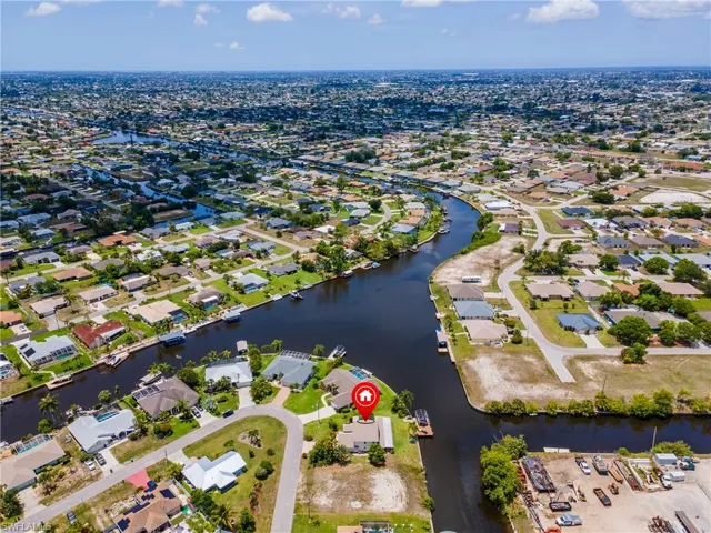 View of property location featuring nearby suburban area and a large body of water