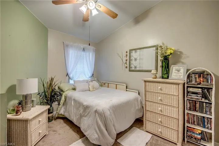 Bedroom featuring vaulted ceiling and ceiling fan
