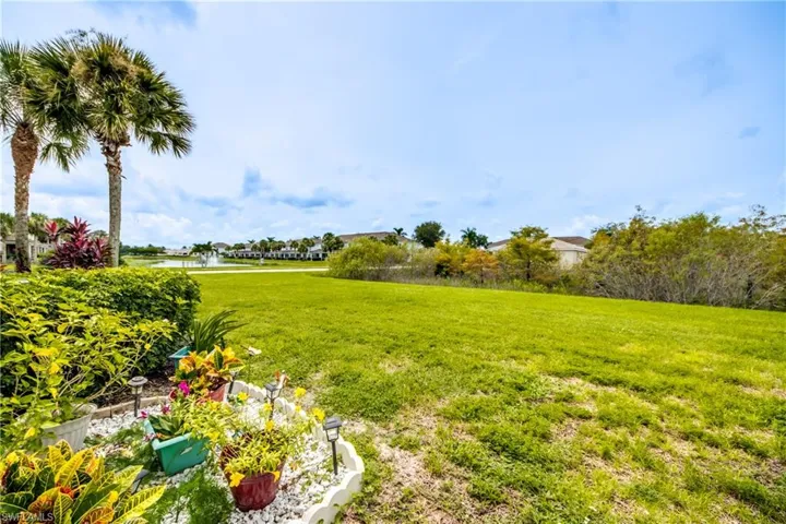 View of green lawn with a water view