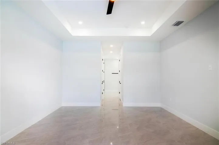 Spare room with a tray ceiling